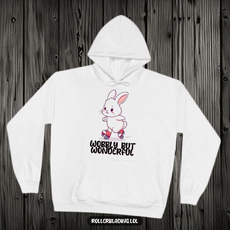 Funny fluffy bunny trying to turn on roller skates, soft hoodie for cozy, humorous moments.